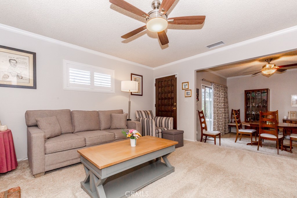 11229 Elmhurst Drive Norwalk, CA 90650 - Photo 14 of 54 a living room with furniture and a flat screen tv