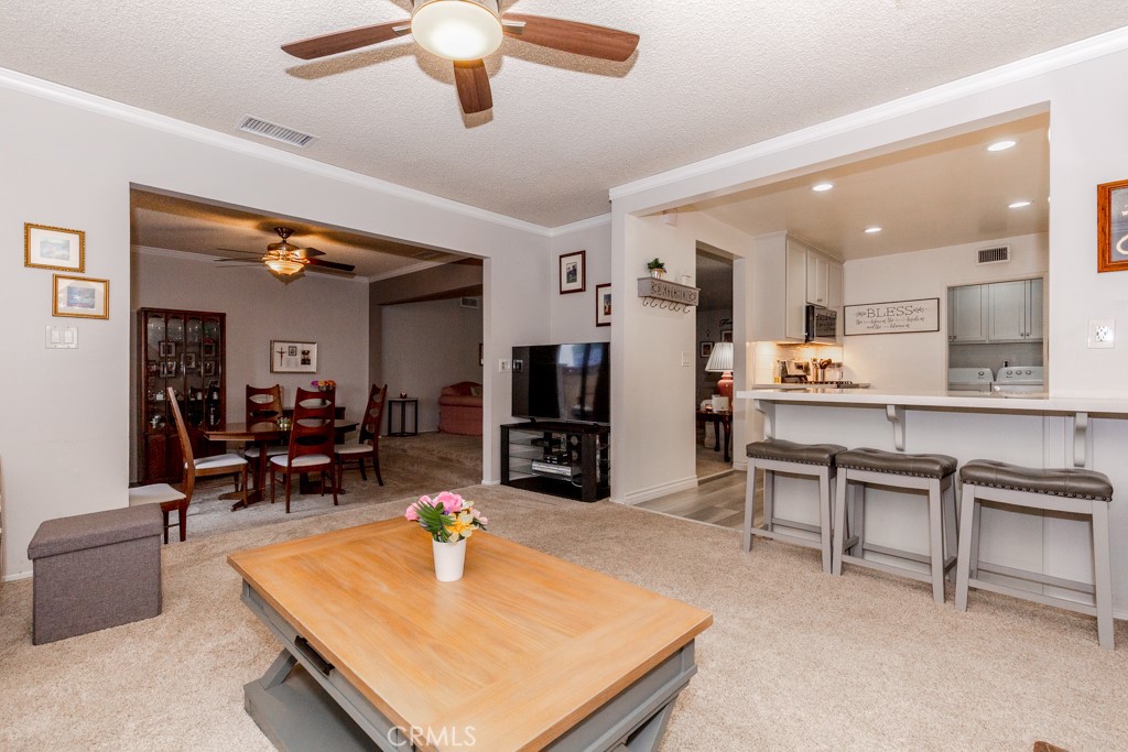11229 Elmhurst Drive Norwalk, CA 90650 - Photo 15 of 54 a living room with furniture and kitchen view