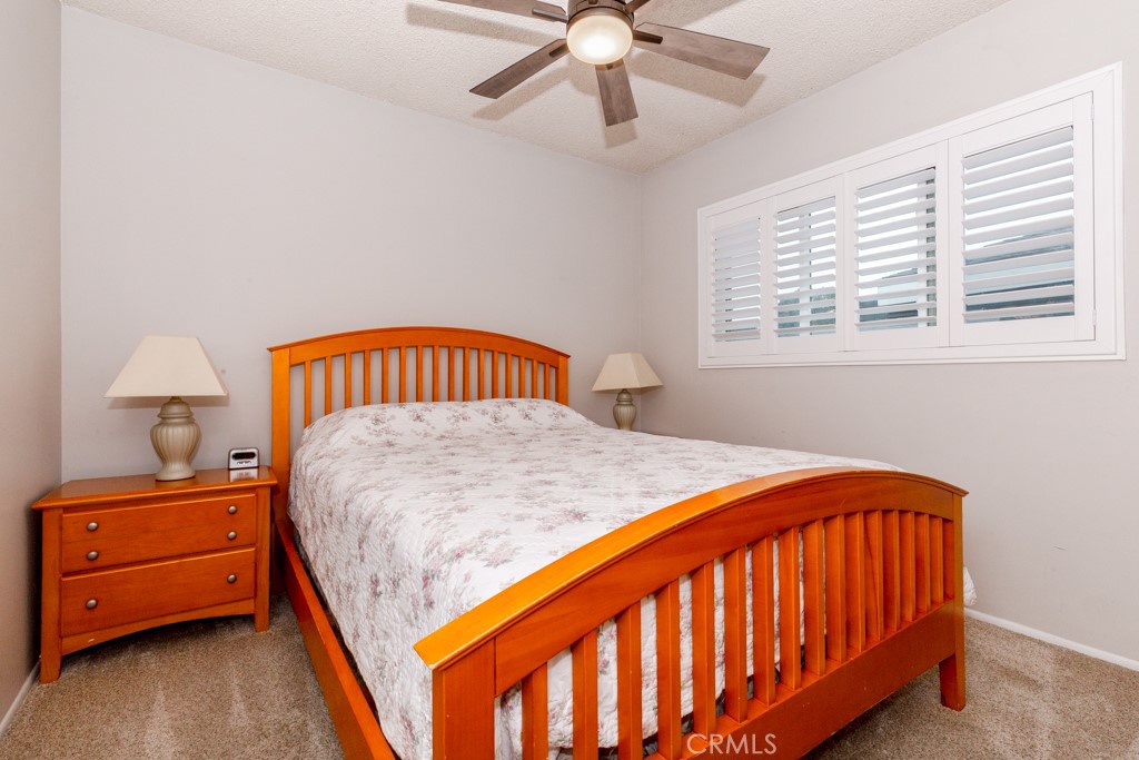 11229 Elmhurst Drive Norwalk, CA 90650 - Photo 28 of 54 a bedroom with a bed and a window