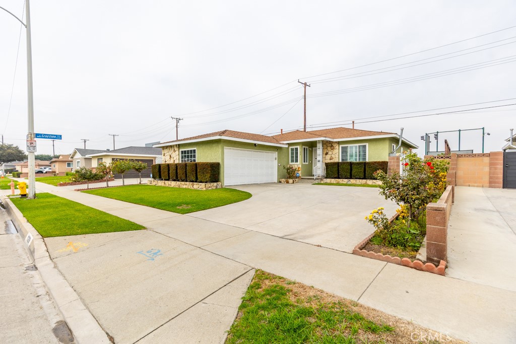 11229 Elmhurst Drive Norwalk, CA 90650 - Photo 3 of 54 a view of a house with a yard