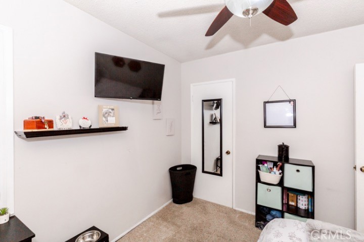 11229 Elmhurst Drive Norwalk, CA 90650 - Photo 31 of 54 a living room with furniture and a flat screen tv