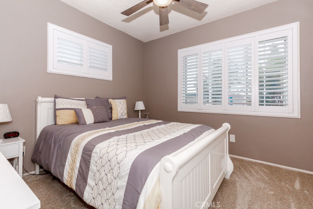 11229 Elmhurst Drive Norwalk, CA 90650 - Photo 33 of 54 a bedroom with a bed and a window