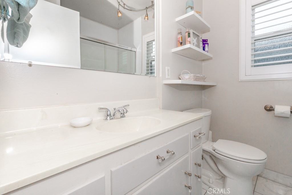 11229 Elmhurst Drive Norwalk, CA 90650 - Photo 36 of 54 a bathroom with a sink and a toilet