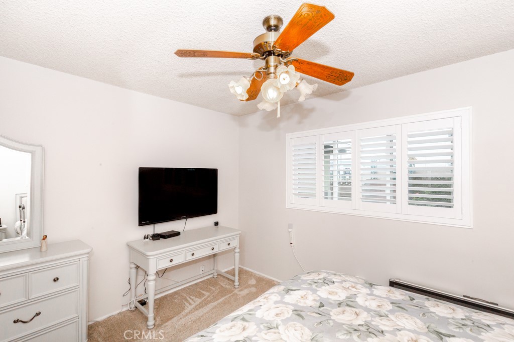 11229 Elmhurst Drive Norwalk, CA 90650 - Photo 41 of 54 a bedroom with a bed and a flat screen tv