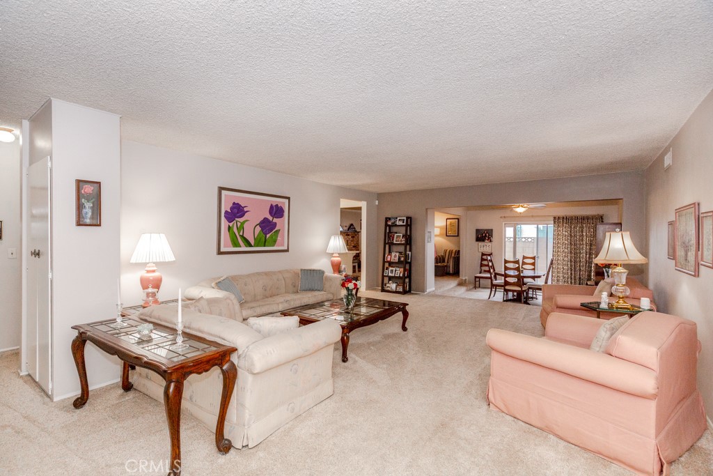 11229 Elmhurst Drive Norwalk, CA 90650 - Photo 8 of 54 a living room with furniture and a potted plant