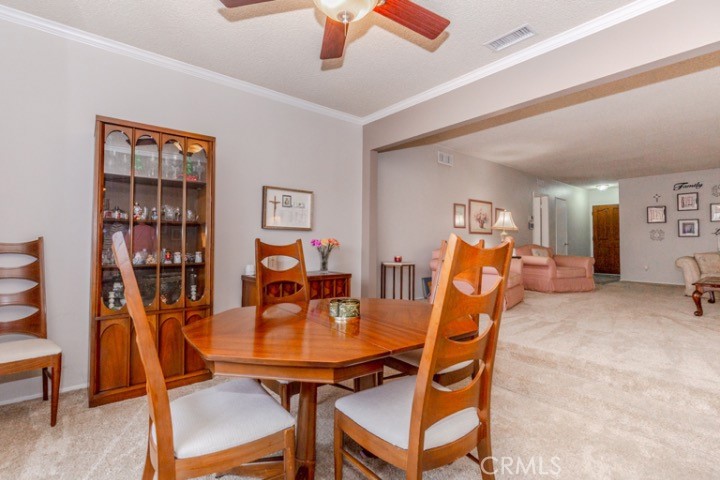 11229 Elmhurst Drive Norwalk, CA 90650 - Photo 10 of 54 a dining room with furniture and wooden floor