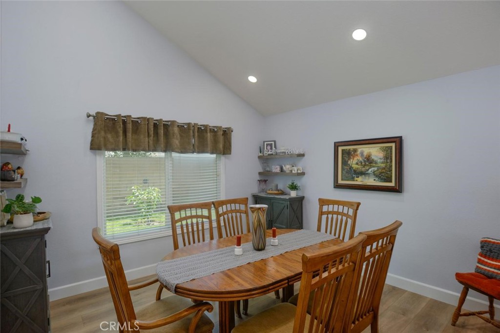 10424 Cartilla Court Rancho Cucamonga, CA 91737 - Photo 5 of 36 a view of a dining room with furniture window and wooden floor