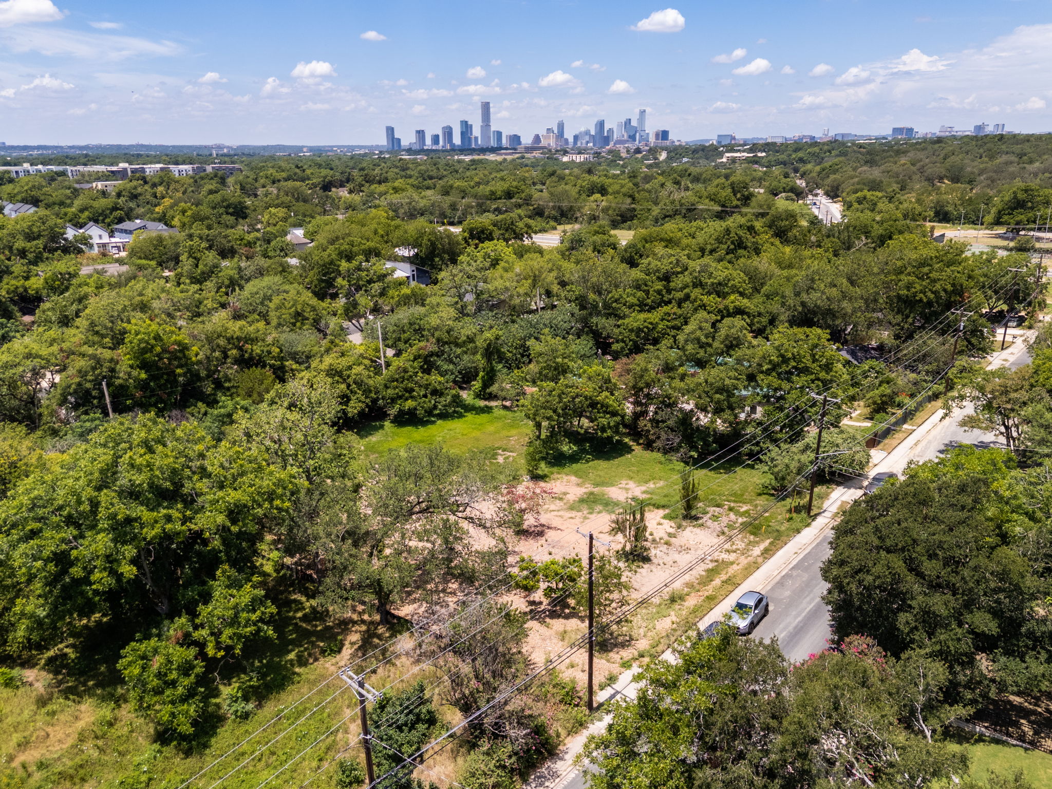4801 Ledesma Road Austin, TX 78721 - Photo 20 of 24 A spacious lot amidst verdant trees offers panoramic city views.