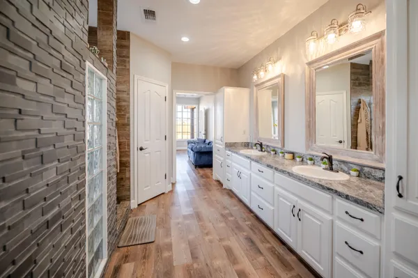 a very nice looking kitchen with a large window a dining table and chairs