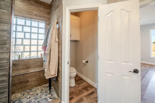 a bedroom with a bed a desk and chair