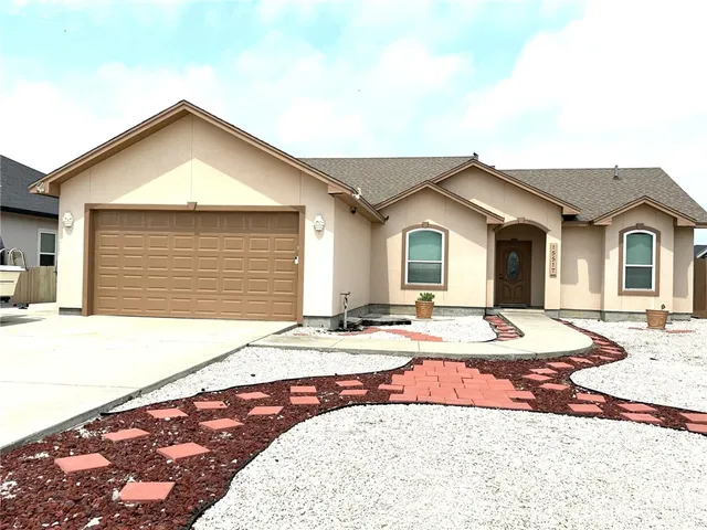 a view of house with backyard and space