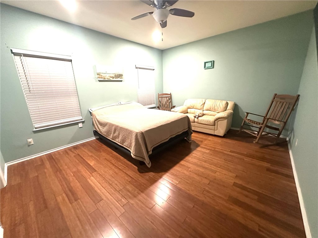 15517 Dyna Street Corpus Christi, TX 78418 - Photo 12 of 16 a spacious bedroom with a bed and window