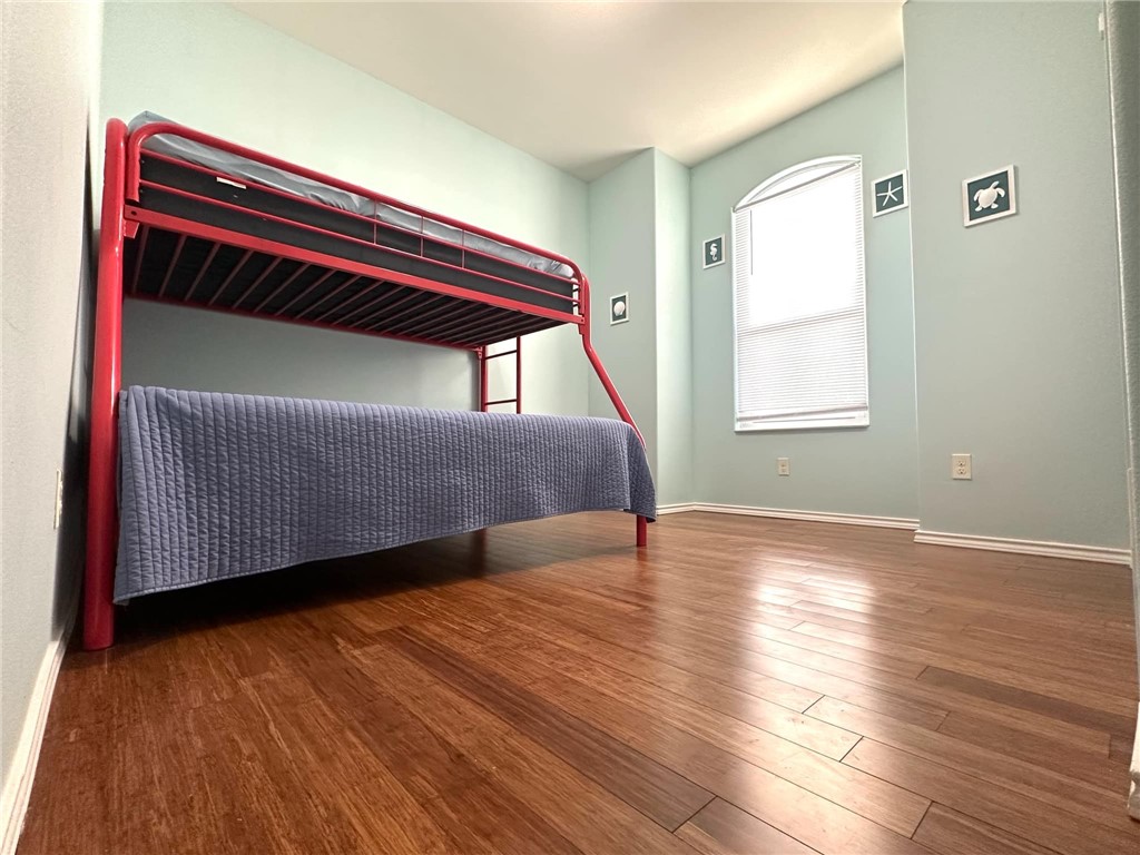 15517 Dyna Street Corpus Christi, TX 78418 - Photo 13 of 16 a room with a bed and a window