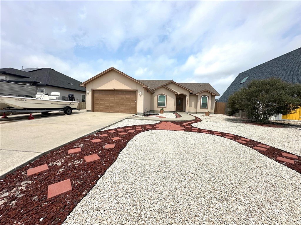 15517 Dyna Street Corpus Christi, TX 78418 - Photo 16 of 16 a row of car parked in front of house with yard