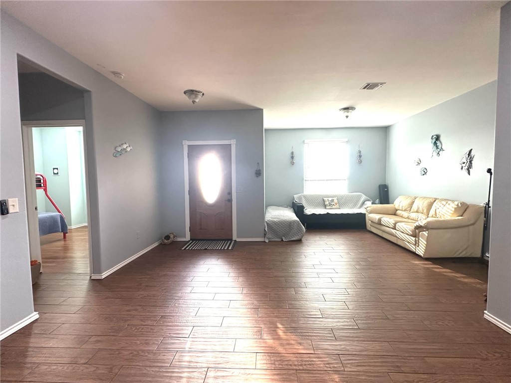 15517 Dyna Street Corpus Christi, TX 78418 - Photo 6 of 16 a living room with furniture and a wooden floor
