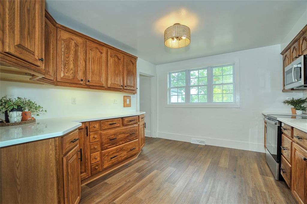 113 3rd Street Houston, PA 15342 - Photo 9 of 27 a kitchen with wooden floors and cabinets