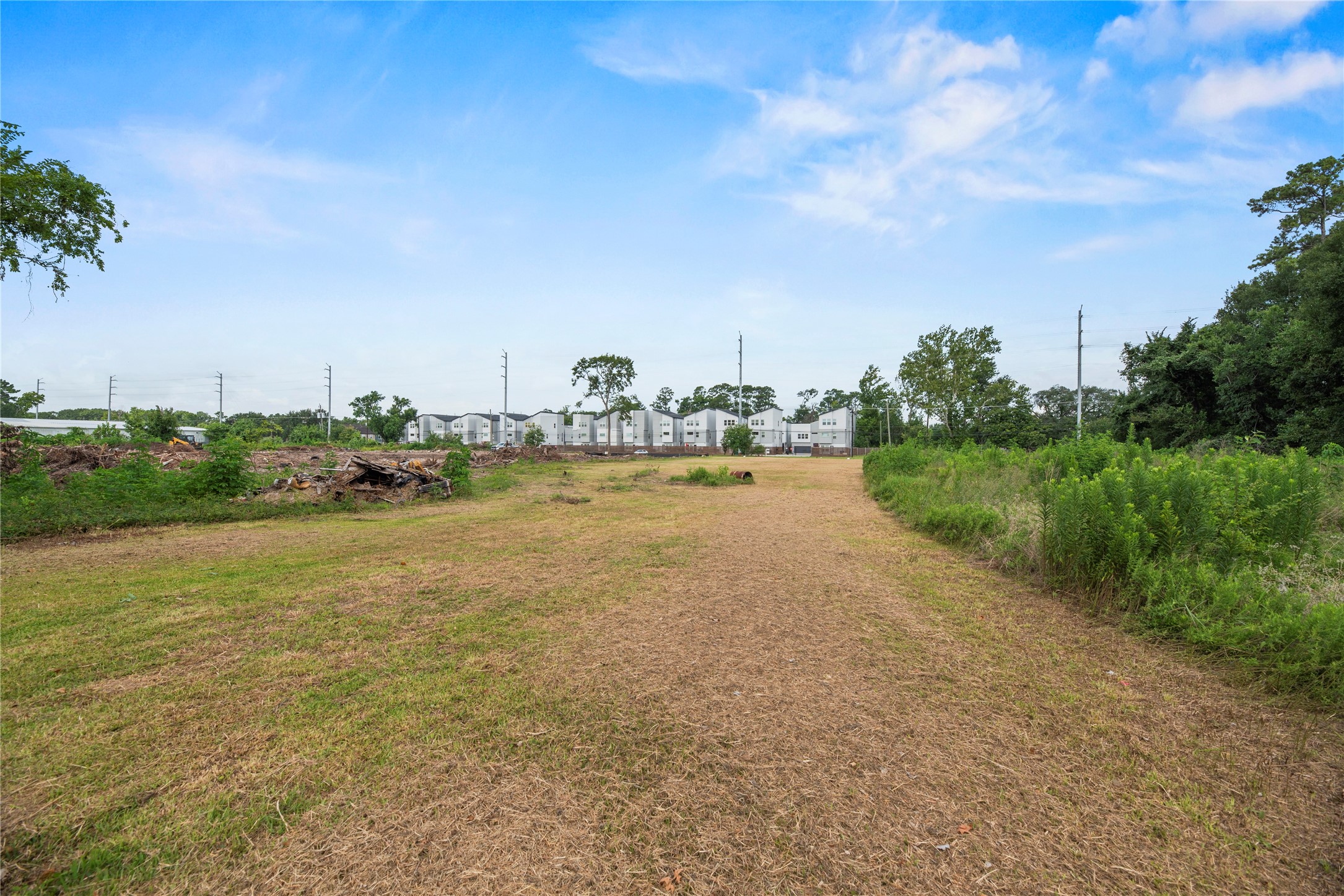 5728 Wheatley Street Houston, TX 77091 - Photo 7 of 9 a view of a lake with houses in the back