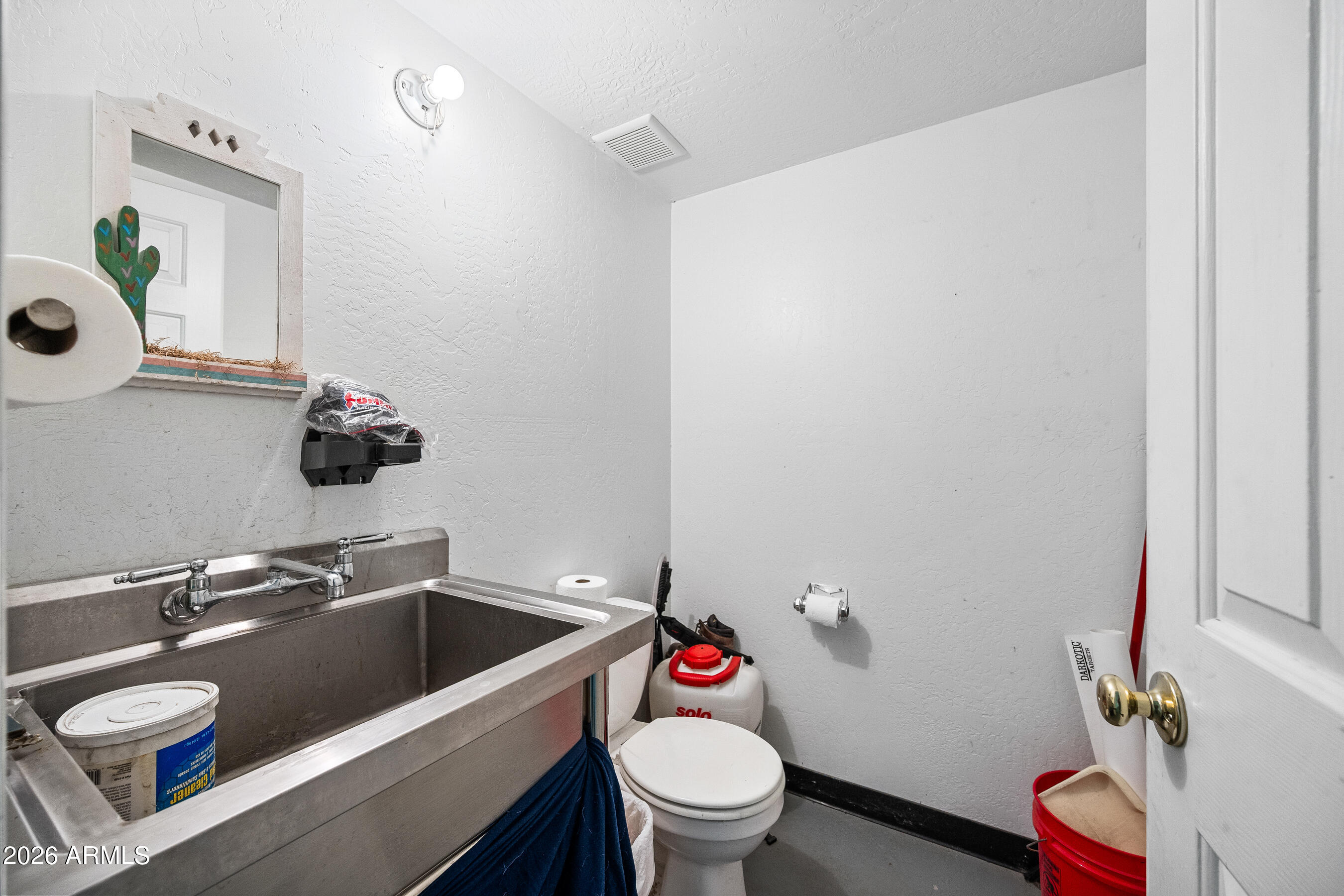 322 East Redfield Road Chandler, AZ 85225 - Photo 46 of 50 a bathroom with a sink and a toilet