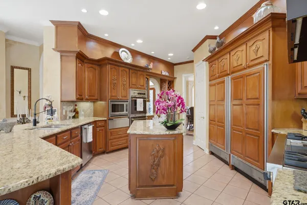 a bathroom with a sink and mirror with painted walls