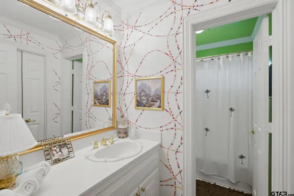 a living room with furniture a rug and a table