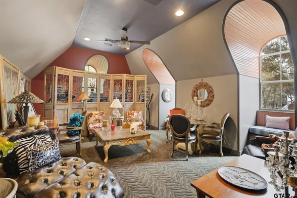 a utility room with cabinets washer and dryer
