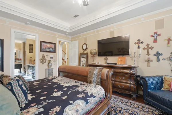 a bathroom with a tub a sink and mirrors