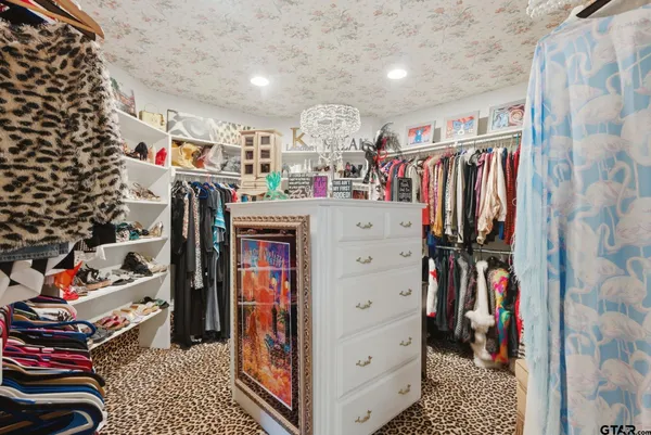 a view of a house with pool and sitting area