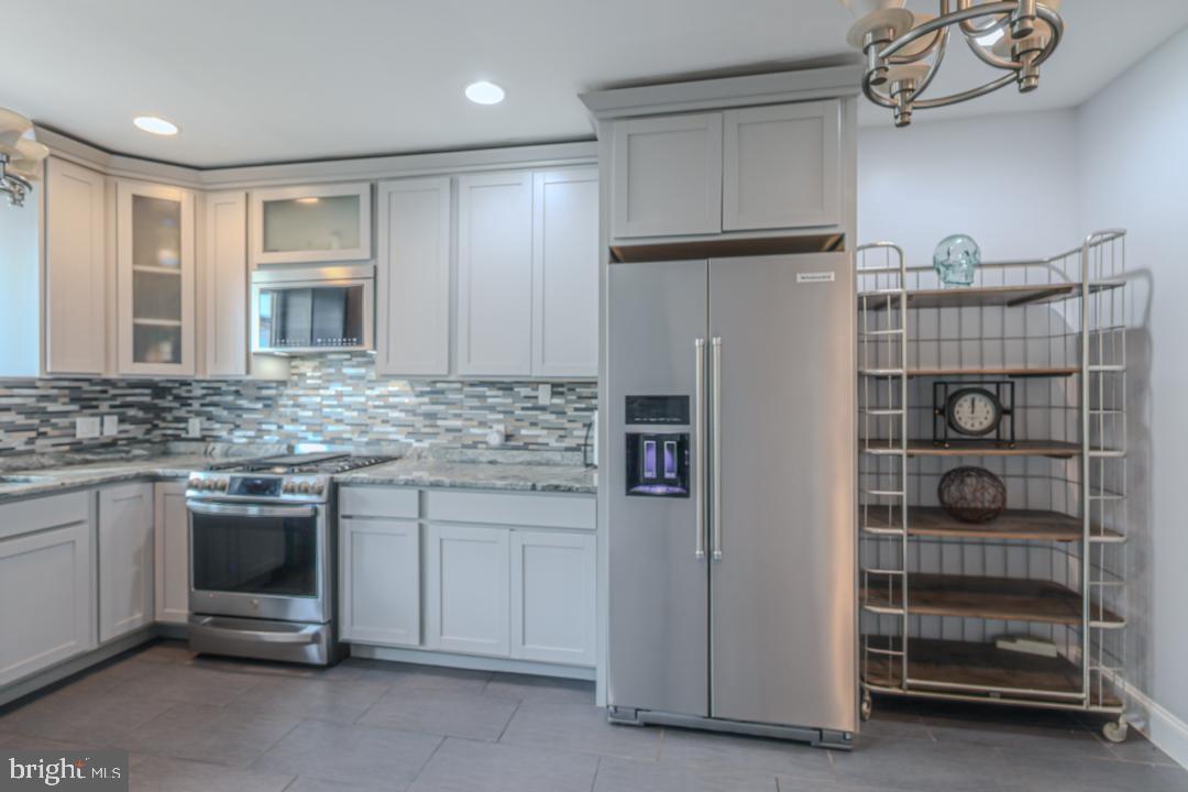 1139 Scott Street Baltimore, MD 21230 - Photo 11 of 60 a kitchen with a refrigerator and a sink