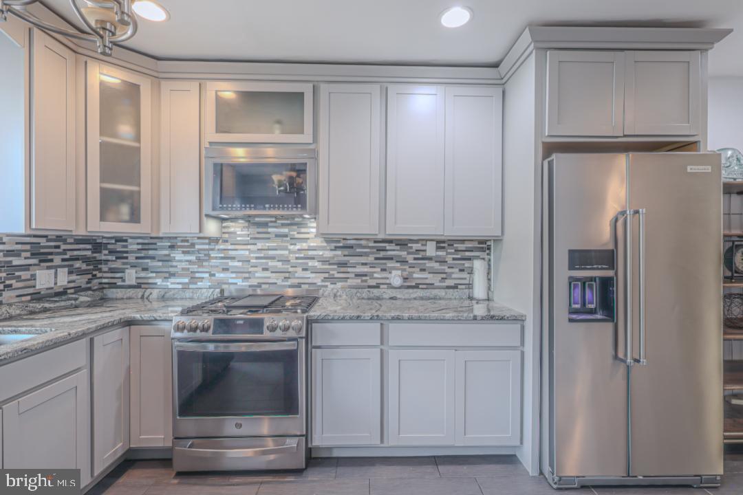 1139 Scott Street Baltimore, MD 21230 - Photo 12 of 60 a kitchen with cabinets and stainless steel appliances