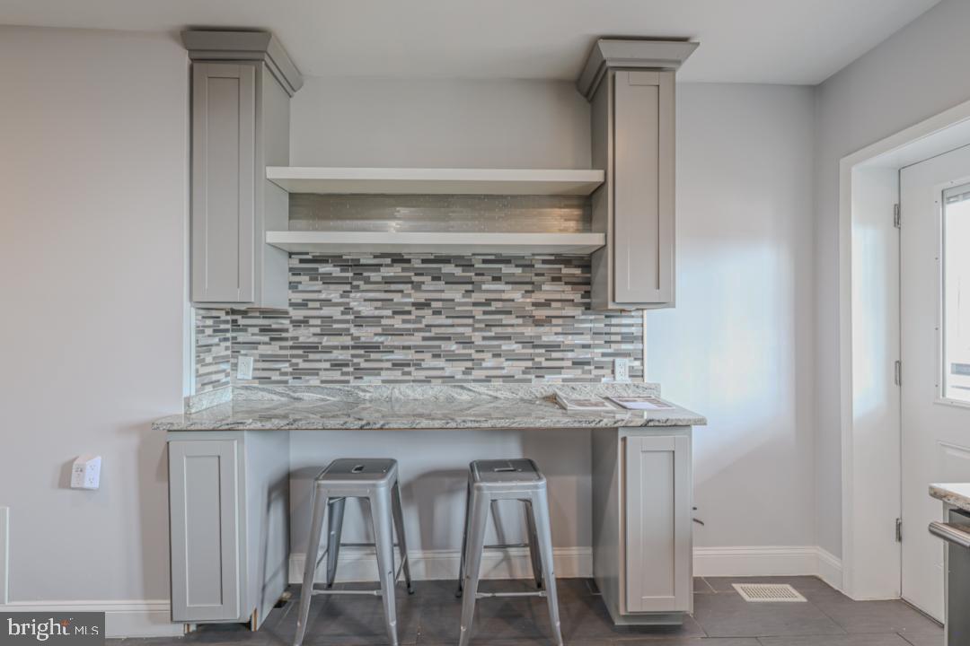 1139 Scott Street Baltimore, MD 21230 - Photo 13 of 60 a kitchen with cabinets and a table