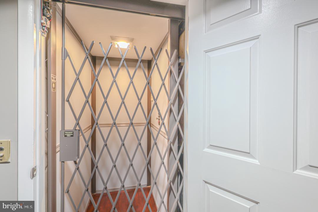 1139 Scott Street Baltimore, MD 21230 - Photo 19 of 60 a bathroom with a glass door and shower curtain