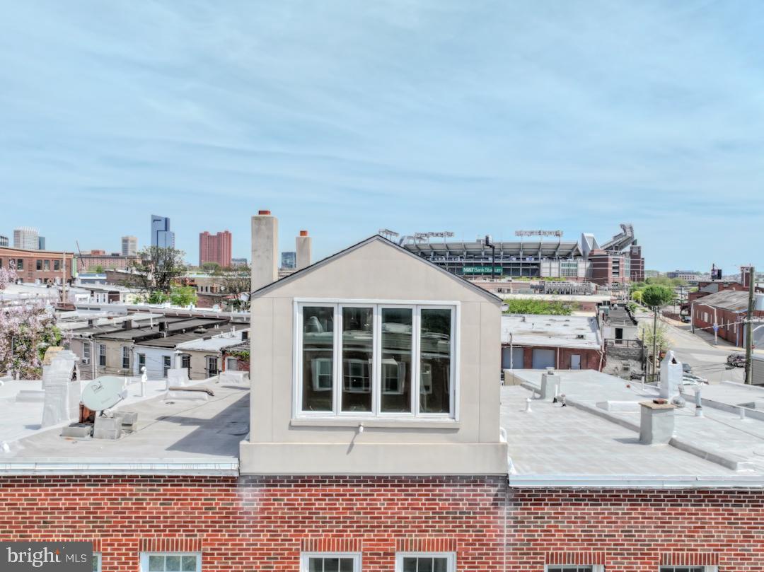 1139 Scott Street Baltimore, MD 21230 - Photo 2 of 60 a view of a terrace with a bench