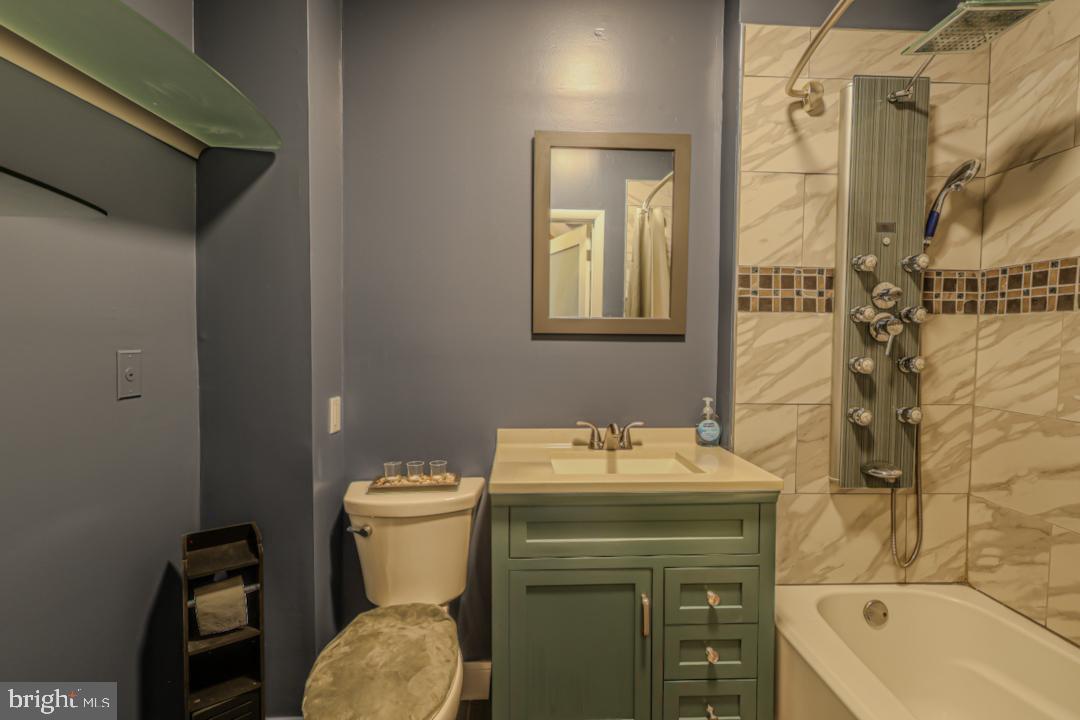 1139 Scott Street Baltimore, MD 21230 - Photo 28 of 60 a bathroom with a sink toilet and shower