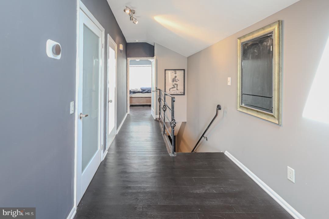 1139 Scott Street Baltimore, MD 21230 - Photo 35 of 60 a view of a hallway with wooden floor and staircase