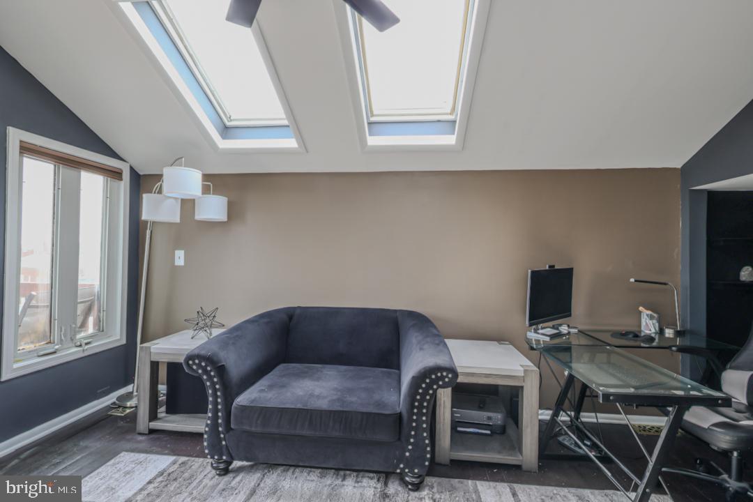 1139 Scott Street Baltimore, MD 21230 - Photo 45 of 60 a view of livingroom with workspace and windows