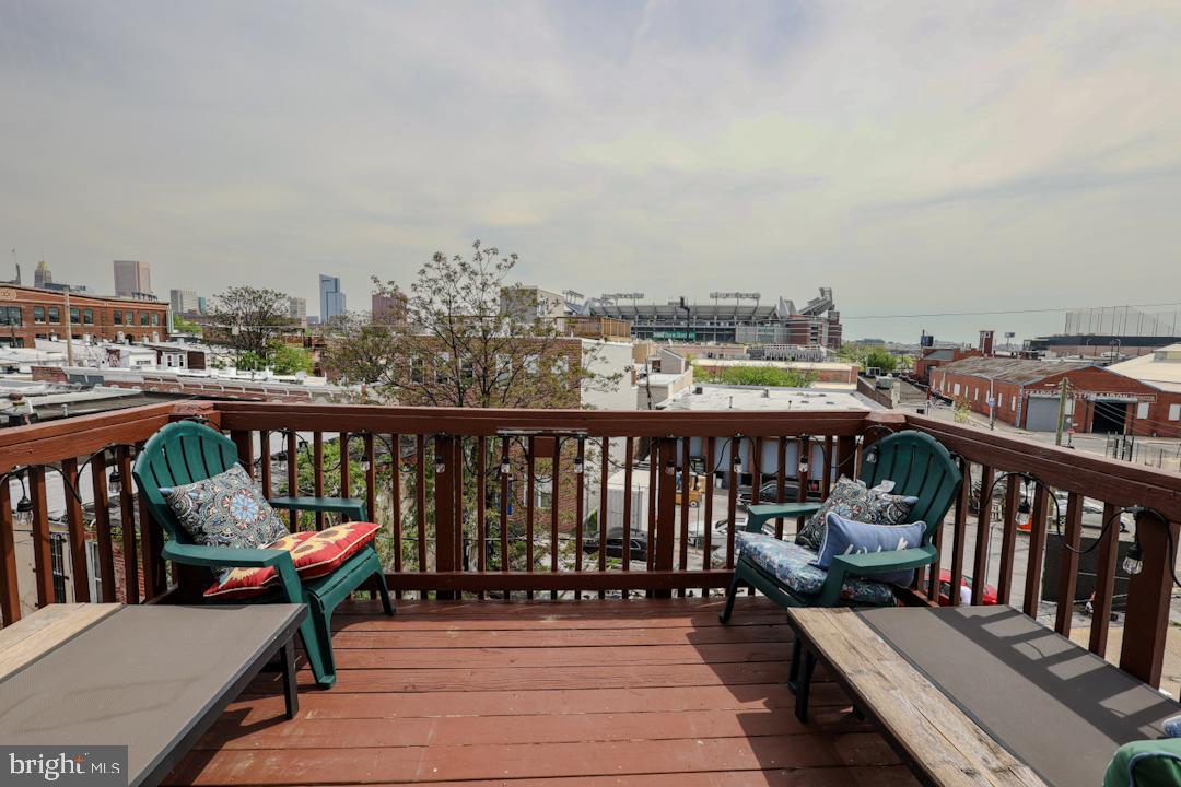 1139 Scott Street Baltimore, MD 21230 - Photo 49 of 60 a view of a balcony with wooden chairs