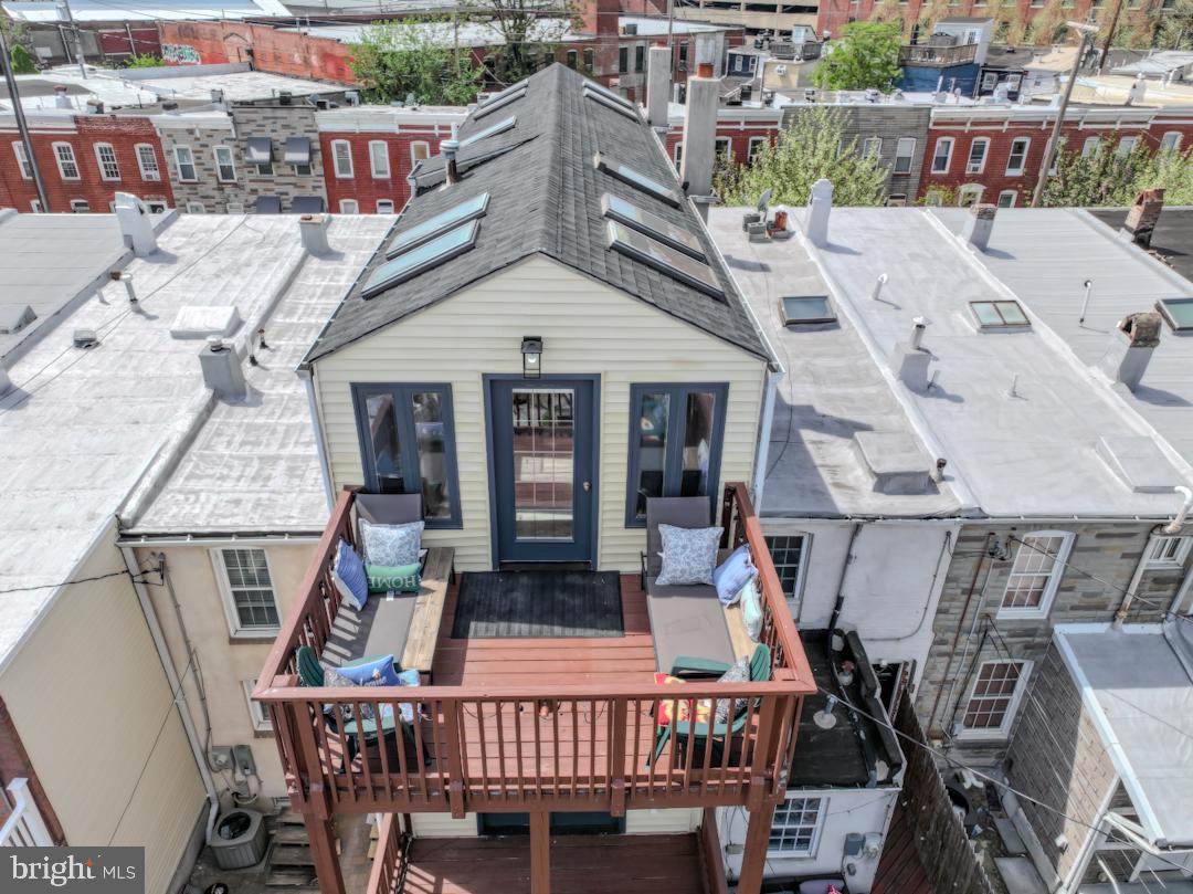 1139 Scott Street Baltimore, MD 21230 - Photo 55 of 60 a view of a roof deck with table and chairs