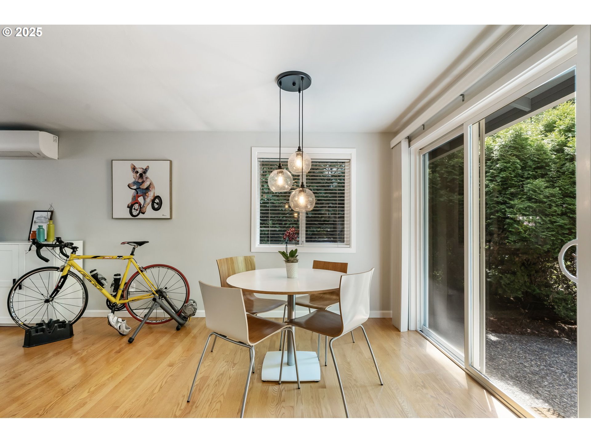 4560 Northwest Barnes Road Portland, OR 97210 - Photo 11 of 36 a dining room with furniture and wooden floor