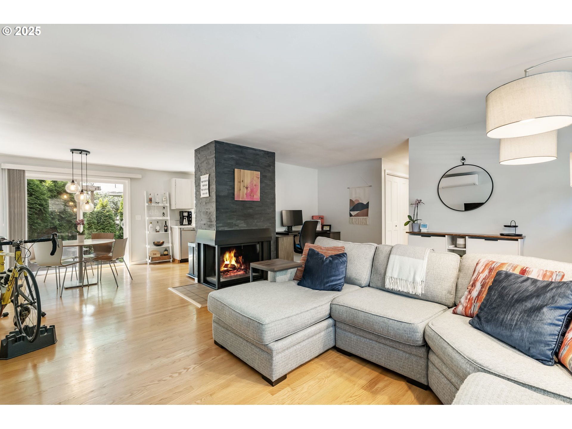 4560 Northwest Barnes Road Portland, OR 97210 - Photo 15 of 36 a living room with furniture and a fireplace