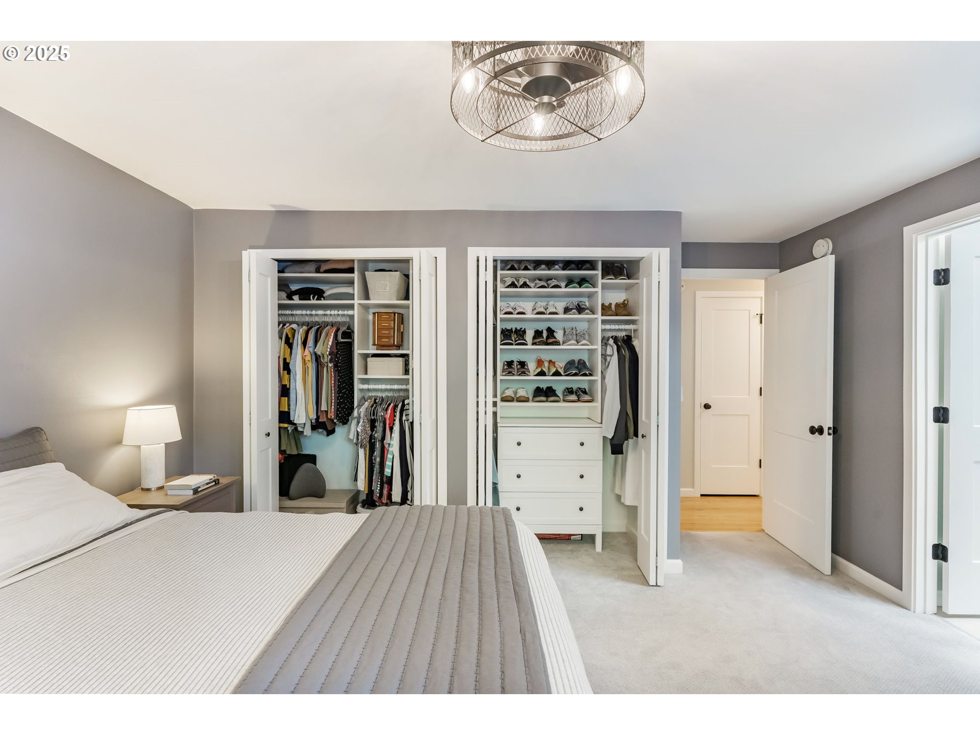 4560 Northwest Barnes Road Portland, OR 97210 - Photo 18 of 36 a bedroom with a bed and a walk in closet