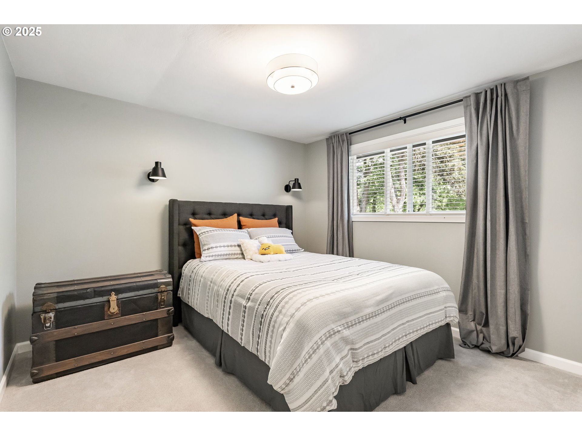 4560 Northwest Barnes Road Portland, OR 97210 - Photo 21 of 36 a bedroom with a bed and a window