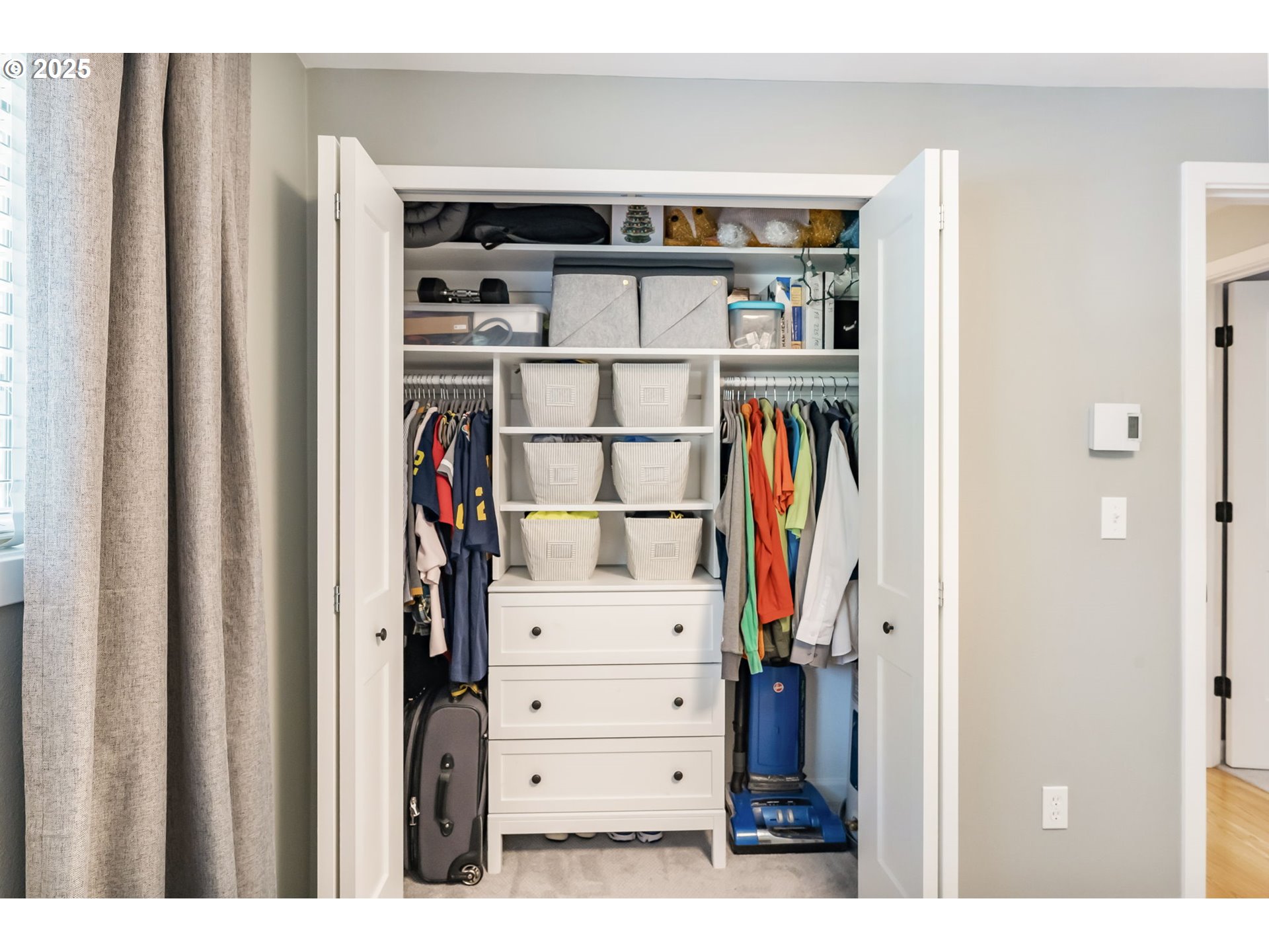 4560 Northwest Barnes Road Portland, OR 97210 - Photo 22 of 36 a view of walk in closet with clothes