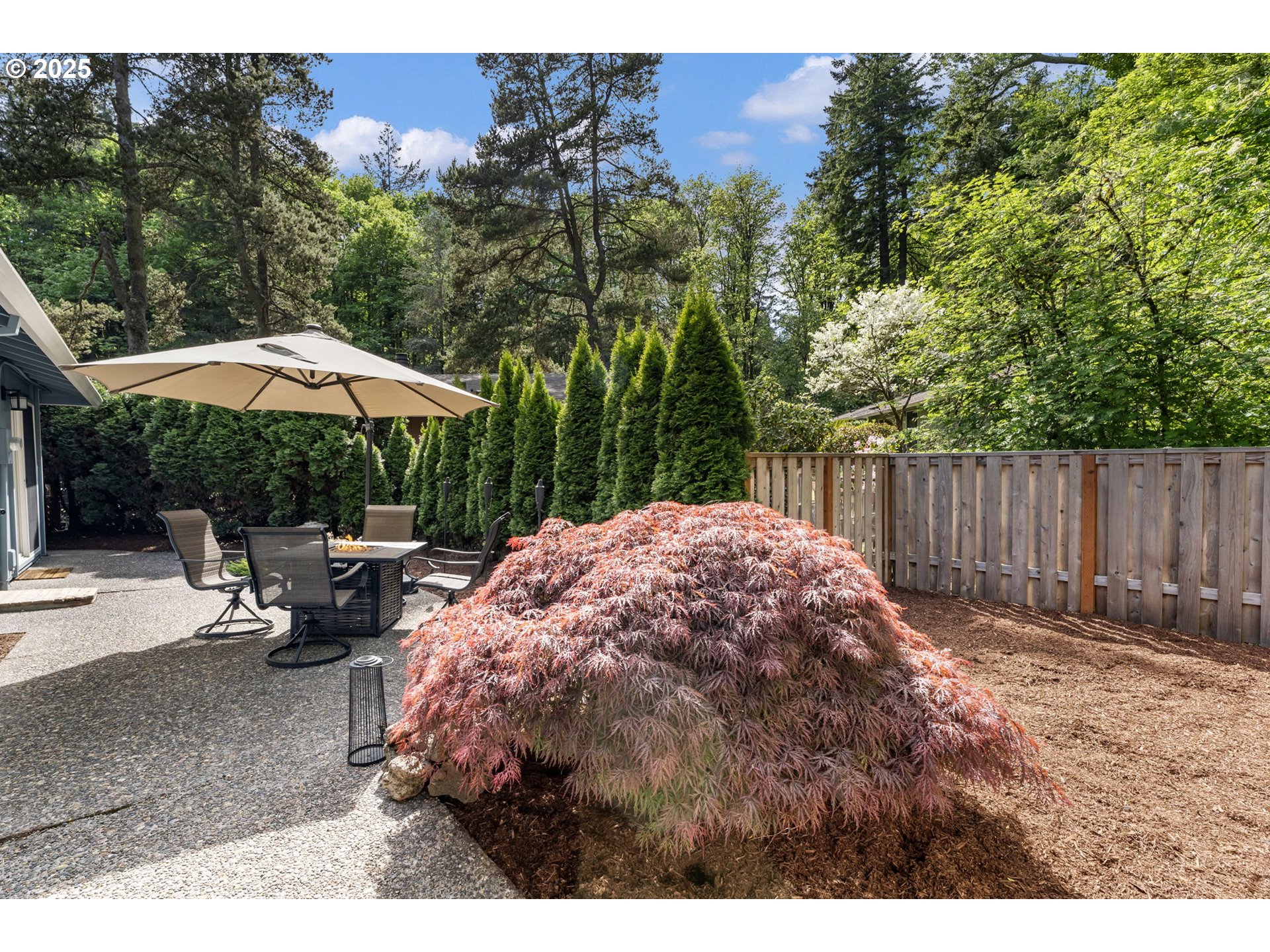 4560 Northwest Barnes Road Portland, OR 97210 - Photo 25 of 36 a backyard of a house with table and chairs