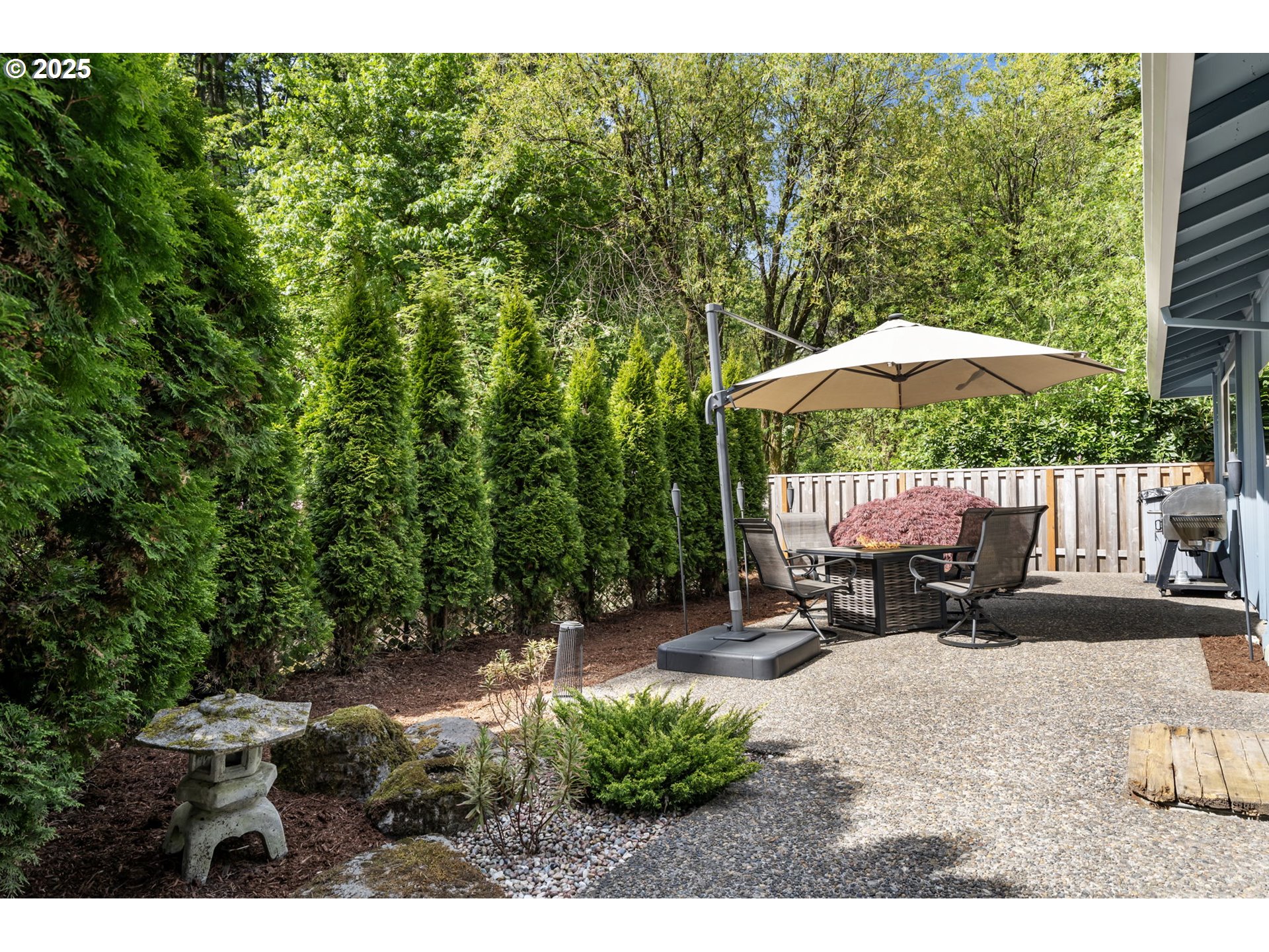 4560 Northwest Barnes Road Portland, OR 97210 - Photo 26 of 36 a view of backyard with a patio and outdoor seating