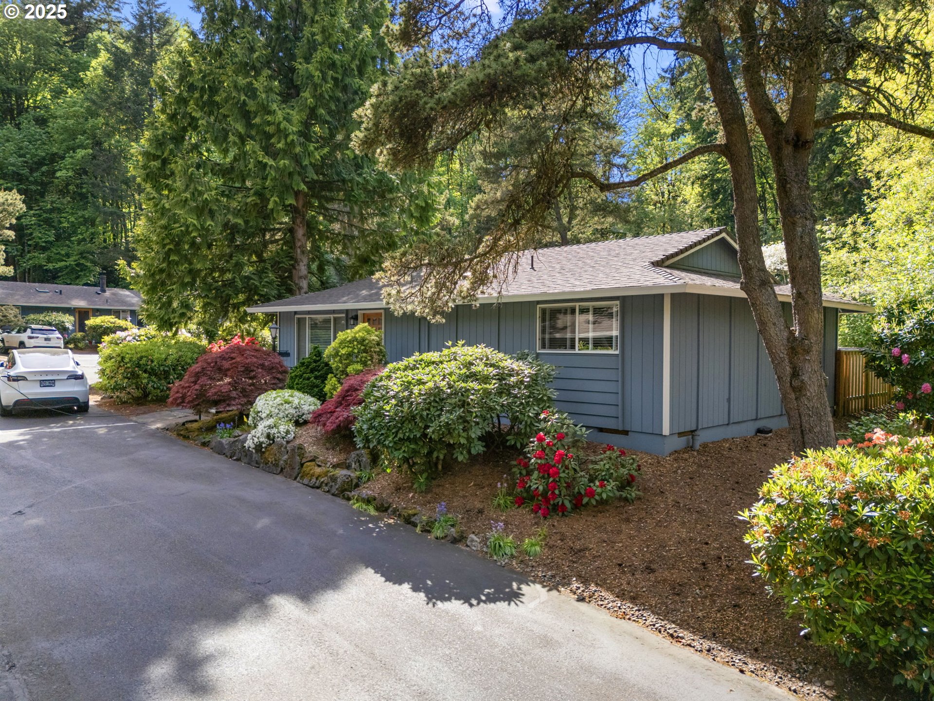 4560 Northwest Barnes Road Portland, OR 97210 - Photo 30 of 36 a front view of a house with garden