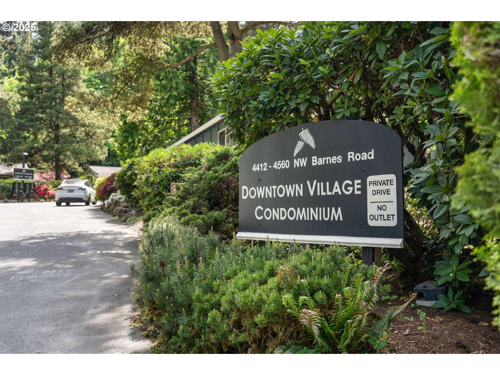 4560 Northwest Barnes Road Portland, OR 97210 - Photo 33 of 36 a sign that is sitting on a brick wall