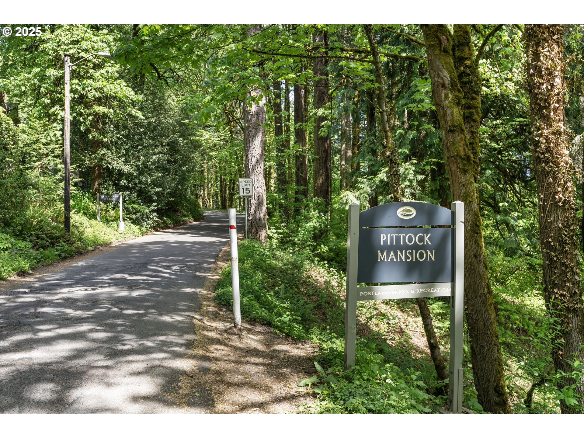 4560 Northwest Barnes Road Portland, OR 97210 - Photo 35 of 36 a sign that is sitting in front of a tree