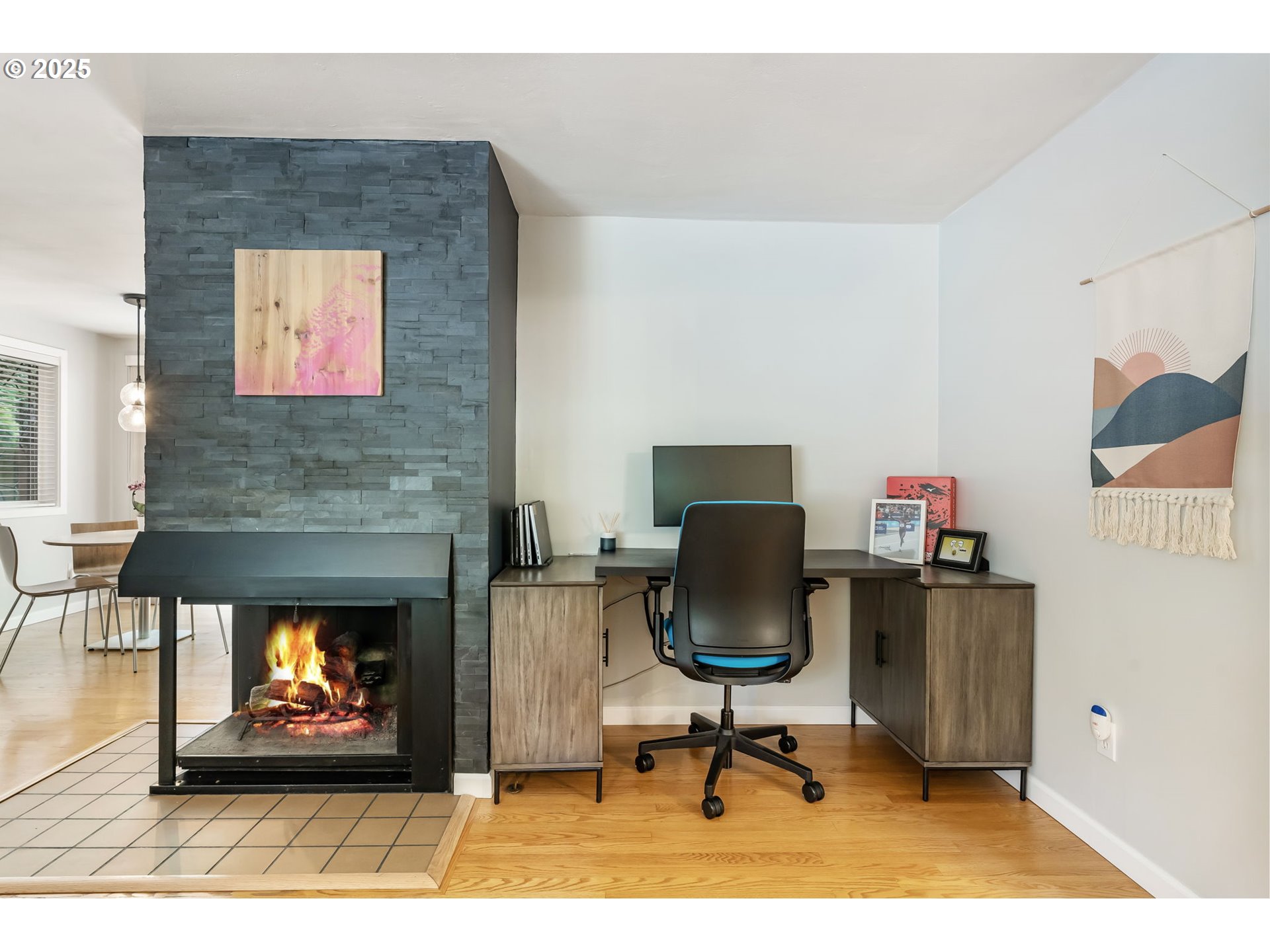 4560 Northwest Barnes Road Portland, OR 97210 - Photo 6 of 36 a living room with furniture a rug and a fireplace