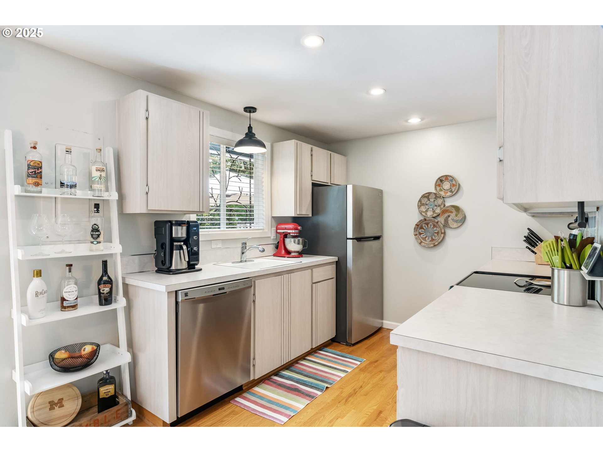 4560 Northwest Barnes Road Portland, OR 97210 - Photo 10 of 36 a kitchen with white cabinets and white appliances