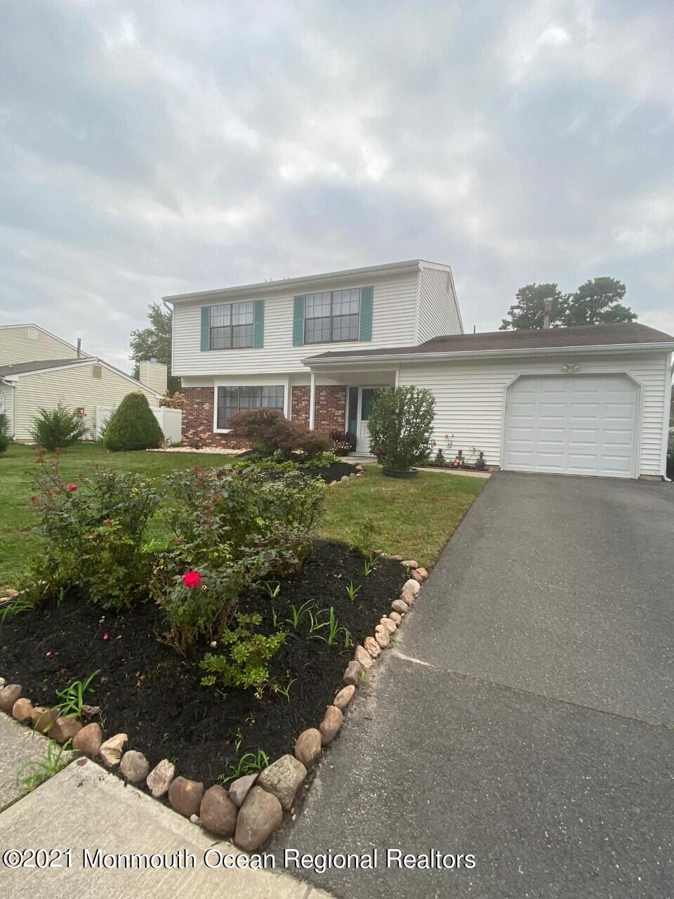 39 Peachstone Road Howell, NJ 07731 - Photo 1 of 38 a house view with a garden space